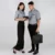 F117 corporate uniform female 3/4 sleeve hidden pocket worn by model